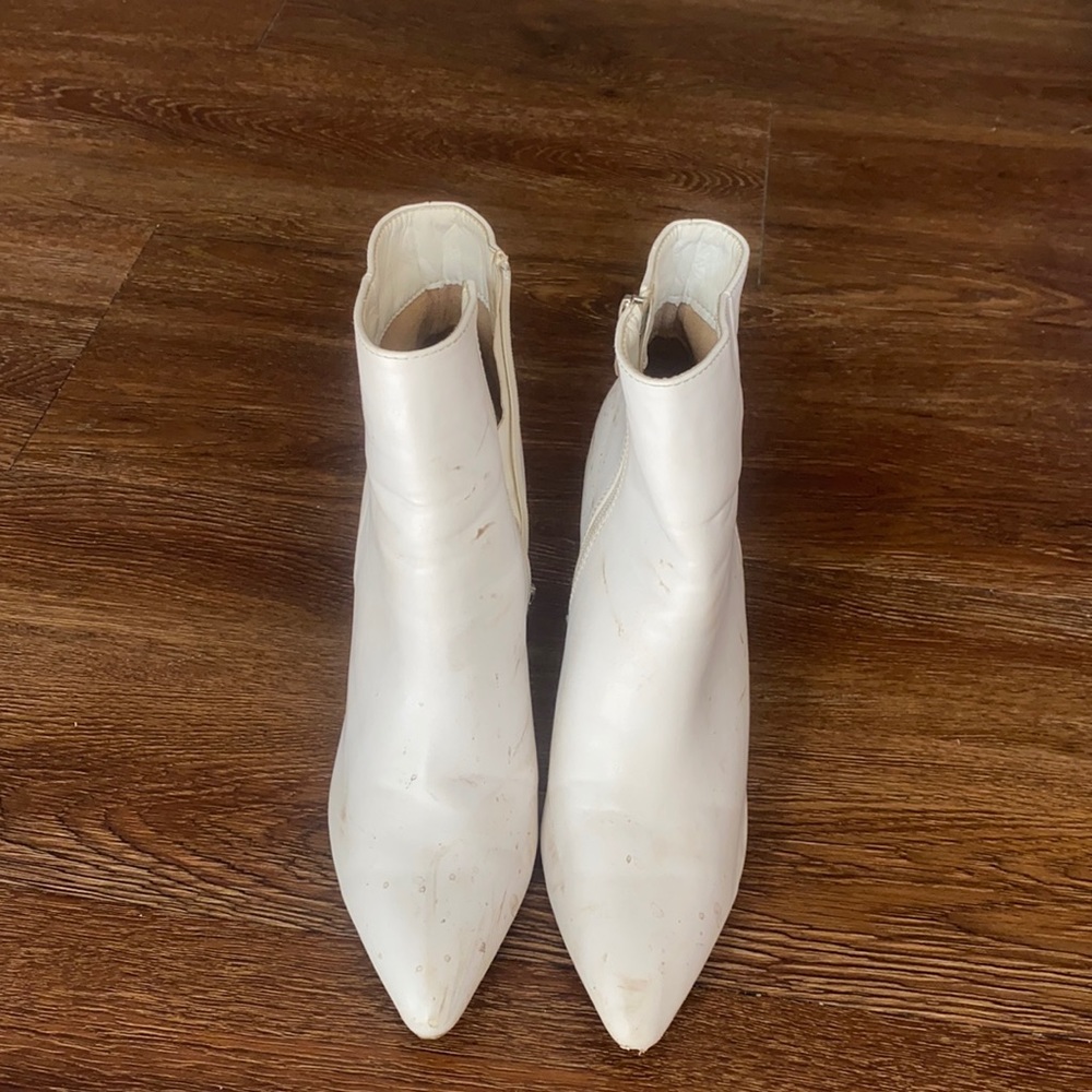 Heeled white booties